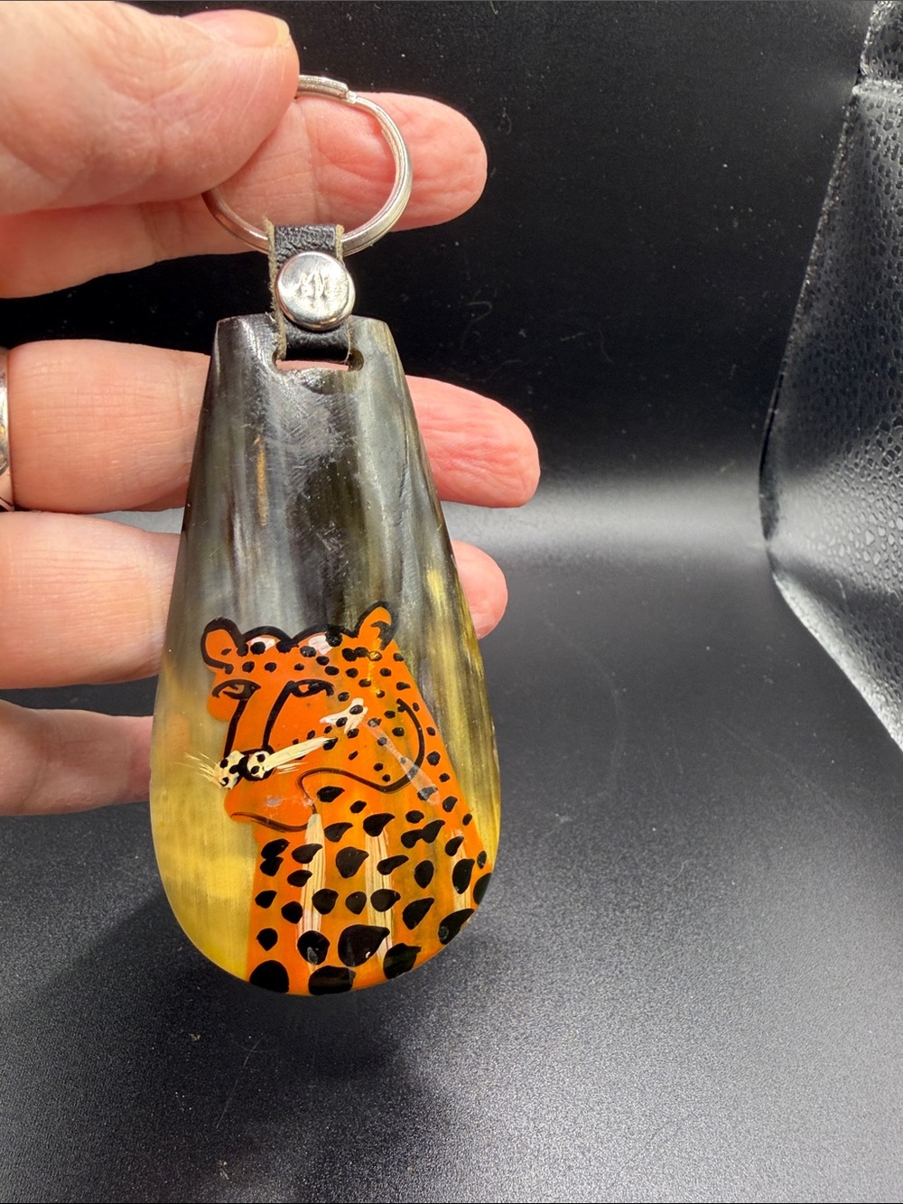 Hand made keychain. Made in Kenya from polished goat horn. Hand painted Cheetah